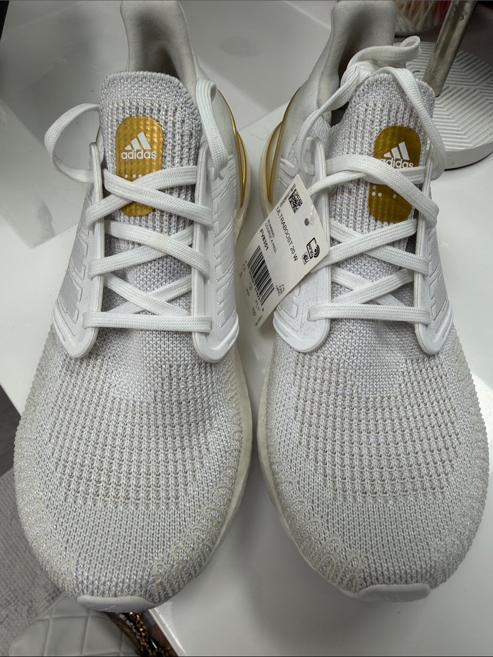 adidas White Knit Running Shoes with Gold Accents